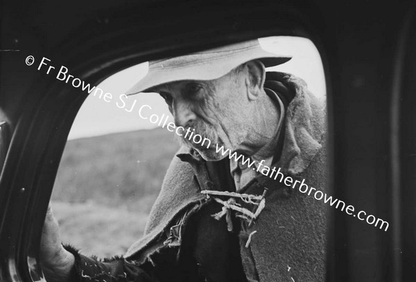 OLD MAN AT CAR WINDOW